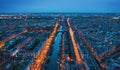 Aerial panoramic view of Amsterdam city in evening. Famous Dutch channels and dancing houses from above. Netherlands