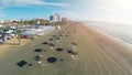 Aerial panoramic view of beach in Larnaca city and straw parasols, Cyprus Royalty Free Stock Photo