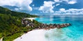 Aerial panoramic view of beautiful Grand Anse beach on La Digue island in Seychelles. Granite boulders ridge and Royalty Free Stock Photo