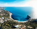 Aerial panoramic view of beautiful seascape with bay, waves, coast with beach, rocks in sea and mountain area in Simeiz, Crimea Royalty Free Stock Photo