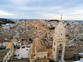 Aerial Panoramic View of the Belltower of the Cathedral of St. Maria La Bruna on Cloudy Sky at Sunset