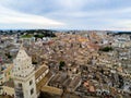 Aerial Panoramic View of the Belltower of the Cathedral of St. Maria La Bruna on Cloudy Sky at Sunset