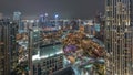 Aerial panoramic view of a big futuristic city night timelapse. Business bay and Downtown Royalty Free Stock Photo