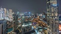 Aerial panoramic view of a big futuristic city night timelapse. Business bay and Downtown Royalty Free Stock Photo