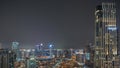 Aerial panoramic view of a big futuristic city night timelapse. Business bay and Downtown Royalty Free Stock Photo