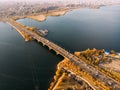 Aerial panoramic view of big river and transportation bridge over it with cars in autumn European city Royalty Free Stock Photo