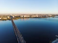 Aerial panoramic view of big river and transportation bridge over it with cars in European city Royalty Free Stock Photo