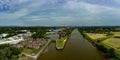 Aerial panoramic view of the bullnose entrance lock gates to Preston Marina off the River Ribble Lancashire England