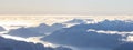 Aerial Panoramic View of Canadian Mountain covered in snow on the West Coast Royalty Free Stock Photo