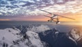 Aerial Panoramic View of Canadian Rocky Mountain Landscape with Seaplane Flying. Royalty Free Stock Photo