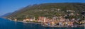 Aerial panoramic view of Castelletto di Brenzone at Garda Lake,  showing the coastline with roads and the tranquil village Royalty Free Stock Photo