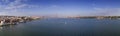 Aerial panoramic view of the city of Lisbon with sail boats on the Tagus River and the 25 of April Bridge Ponte 25 de Abril on t Royalty Free Stock Photo