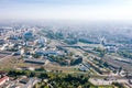 Aerial panoramic view of cityscape with lots of residential and industrial manufacturing buildings