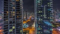 Aerial view on Dubai Marina skyscrapers and the most luxury yacht in harbor night timelapse, Dubai, United Arab Emirates Royalty Free Stock Photo