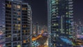 Aerial view on Dubai Marina skyscrapers and the most luxury yacht in harbor night timelapse, Dubai, United Arab Emirates Royalty Free Stock Photo