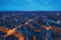 Aerial panoramic view of evening Amsterdam with water canals, illuminated roads and historic buildings, The Netherlands Royalty Free Stock Photo