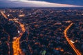 Aerial panoramic view, flight on drone above night city Voronezh with illuminated roads and high-rise buildings