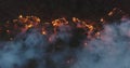 Aerial panoramic view of a forest fire at night, heavy smoke causes air pollution, and fire in full blaze. Natural