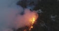 Aerial panoramic view of a forest fire at night, heavy smoke causes air pollution, and fire in full blaze. Natural