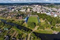 aerial panoramic view from great height of provincial town with a private sector and high-rise urban apartment buildings Royalty Free Stock Photo