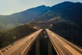 Aerial panoramic view on the highway bridge over the deep gorge Royalty Free Stock Photo