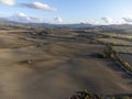 Aerial panoramic view on hills near Pienza, Tuscany, Italy. Tuscan landscape with cypress trees, vineyards, forests and ploughed Royalty Free Stock Photo