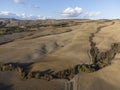 Aerial panoramic view on hills near Pienza, Tuscany, Italy. Tuscan landscape with cypress trees, vineyards, forests and ploughed Royalty Free Stock Photo