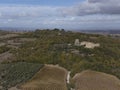 Aerial panoramic view on hills of Val d`Orcia near Bagno Vignoni, Tuscany, Italy. Tuscan landscape with cypress trees, vineyards, Royalty Free Stock Photo