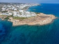 Aerial panoramic view on holidays resorts and blue crystal clear water on Mediterranean sea near Fig Tree beach, Protaras, Cyprus Royalty Free Stock Photo