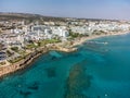 Aerial panoramic view on holidays resorts and blue crystal clear water on Mediterranean sea near Fig Tree beach, Protaras, Cyprus Royalty Free Stock Photo