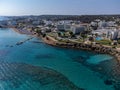 Aerial panoramic view on holidays resorts and blue crystal clear water on Mediterranean sea near Fig Tree beach, Protaras, Cyprus Royalty Free Stock Photo