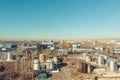 Aerial panoramic view of industrial factory or plant buildings with steel storage construction tanks and pipes