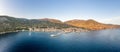 Aerial panoramic view of Komiza village coastline on Vis Island in Croatia sunset hour Royalty Free Stock Photo