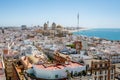 Aerial panoramic view of the old city rooftops and Cathedral de Santa Cruz in the afternoon from tower Tavira in Cadiz Royalty Free Stock Photo