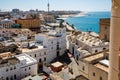 Aerial panoramic view of the old city rooftops and Cathedral de Santa Cruz in the afternoon from tower Tavira in Cadiz Royalty Free Stock Photo