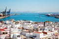 Aerial panoramic view of the old city rooftops and Cathedral de Santa Cruz in the afternoon from tower Tavira in Cadiz Royalty Free Stock Photo