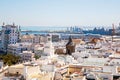 Aerial panoramic view of the old city rooftops and Cathedral de Santa Cruz in the afternoon from tower Tavira in Cadiz Royalty Free Stock Photo