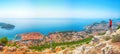 Aerial panoramic view of the old town of Dubrovnik with famous Cable Car on Srd mountain on a sunny day Royalty Free Stock Photo