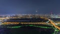 Aerial panoramic view over Vienna city with skyscrapers, historic buildings and a riverside promenade night timelapse in Royalty Free Stock Photo