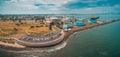 Aerial panoramic view of parking lot and industrial wharfs near ocean coastline at Williamstown suburb of Melbourne, Australia.