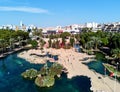 Aerial panoramic view pond, shape of the European continent in the Park of Nations and Torrevieja cityscape Royalty Free Stock Photo