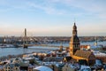 Aerial panoramic view of Riga old town, clock tower, Daugava river and modern bridge. Winter sunny day Royalty Free Stock Photo