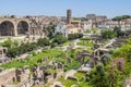 Aerial panoramic view of the ruins of the Roman Forum with Colosseum in background Royalty Free Stock Photo