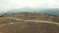 Aerial panoramic view of a scenic hilly dry valley surrounded by Canadian mountain landscape. Shot. Concept of Royalty Free Stock Photo