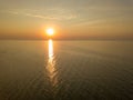 Aerial panoramic view of sunrise over sea. Nothing but sky, clouds and water. Beautiful serene scene Royalty Free Stock Photo