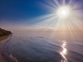 Aerial panoramic view of sunrise over sea. Nothing but sky, clouds and water. Beautiful serene scene Royalty Free Stock Photo