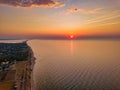 Aerial panoramic view of sunrise over sea. Nothing but sky, clouds and water. Beautiful serene scene Royalty Free Stock Photo