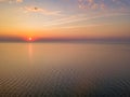 Aerial panoramic view of sunrise over sea. Nothing but sky, clouds and water. Beautiful serene scene Royalty Free Stock Photo