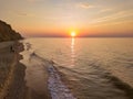 Aerial panoramic view of sunrise over sea. Nothing but sky, clouds and water. Beautiful serene scene Royalty Free Stock Photo