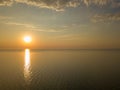 Aerial panoramic view of sunset over sea. Nothing but sky, clouds and water. Beautiful serene scene Royalty Free Stock Photo